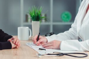 Woman making appointment for medical exam at general practitione